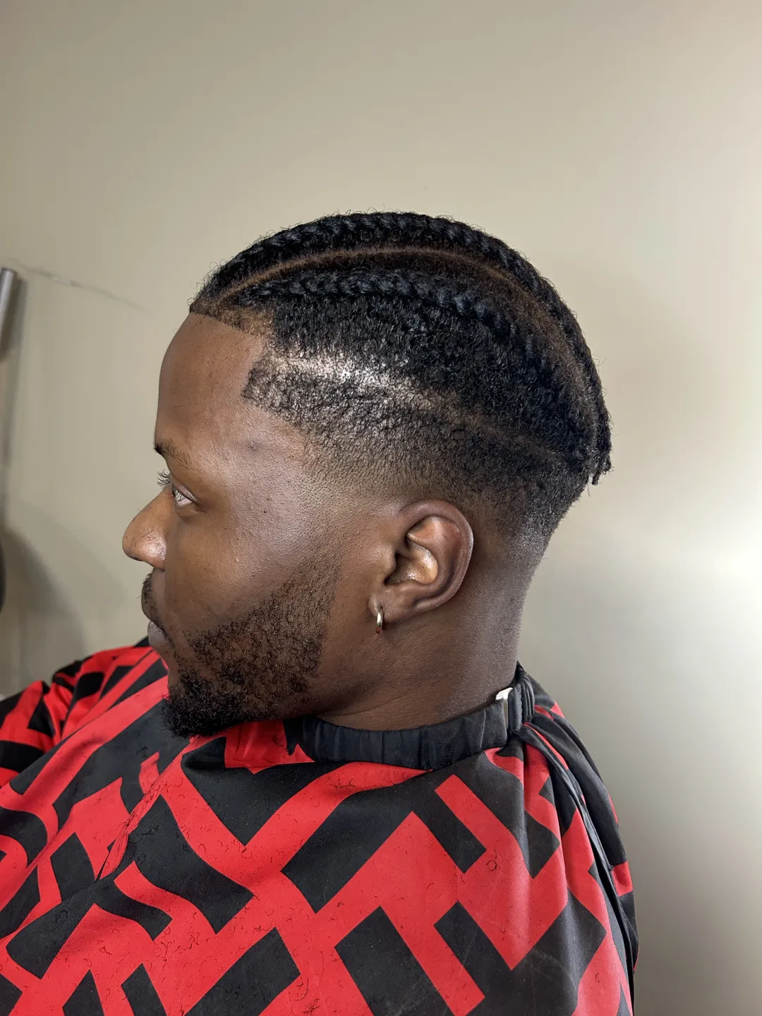 Braids with taper fade and crisp lineup — cut at Studio K barbershop in Guelph