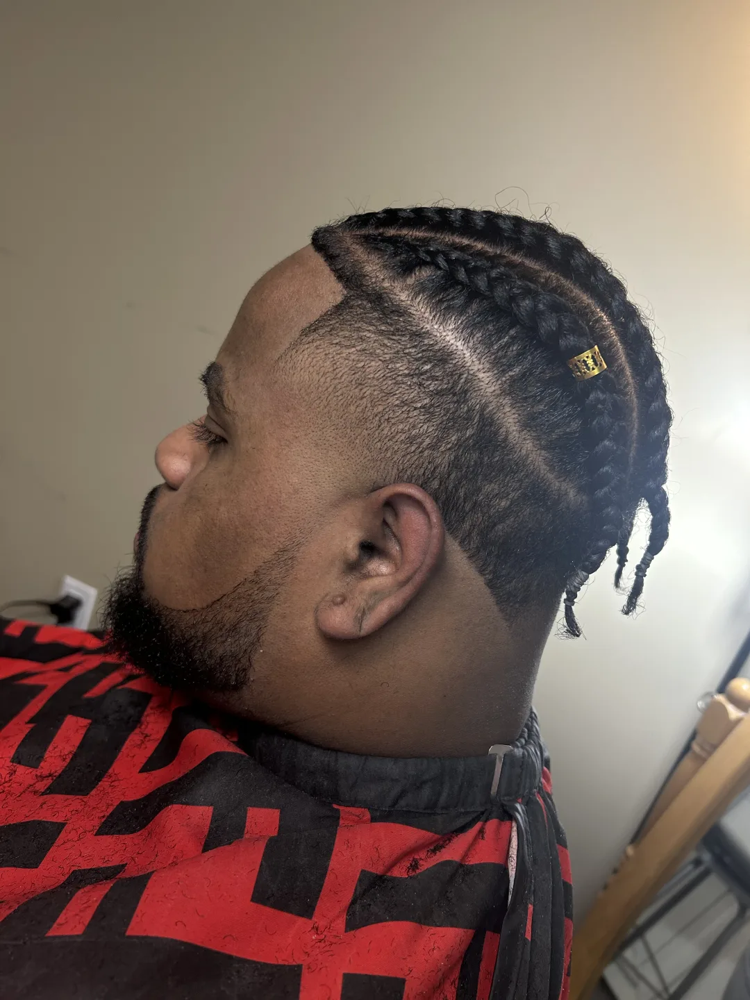 Cornrow braids over a skin fade with sharp line-up — braids and fade at Studio K, Guelph